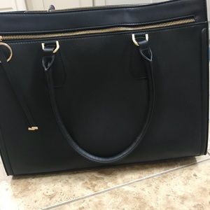 Black purse with laptop compartment
